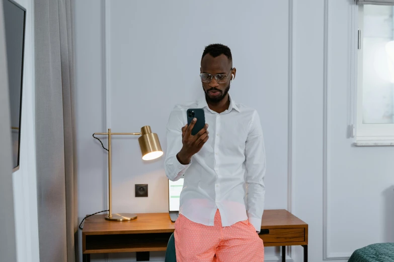 a man taking a selfie in a hotel room, by Barthélemy Menn, pexels contest winner, happening, wearing pants, avatar image, african man, white dress shirt