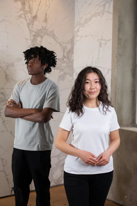 a couple of people standing next to each other, inspired by Kim Tschang Yeul, gutai group, tan skin a tee shirt and shorts, ouchh and and innate studio, white and grey, developers