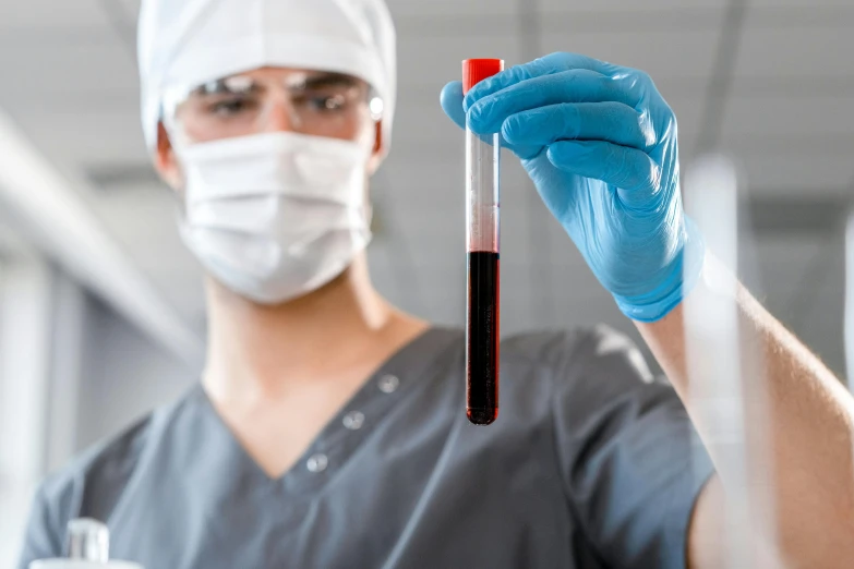 a close up of a person holding a tube of blood, a picture, shutterstock, analytical art, masked doctors, gradient red to black, hgh, local conspirologist