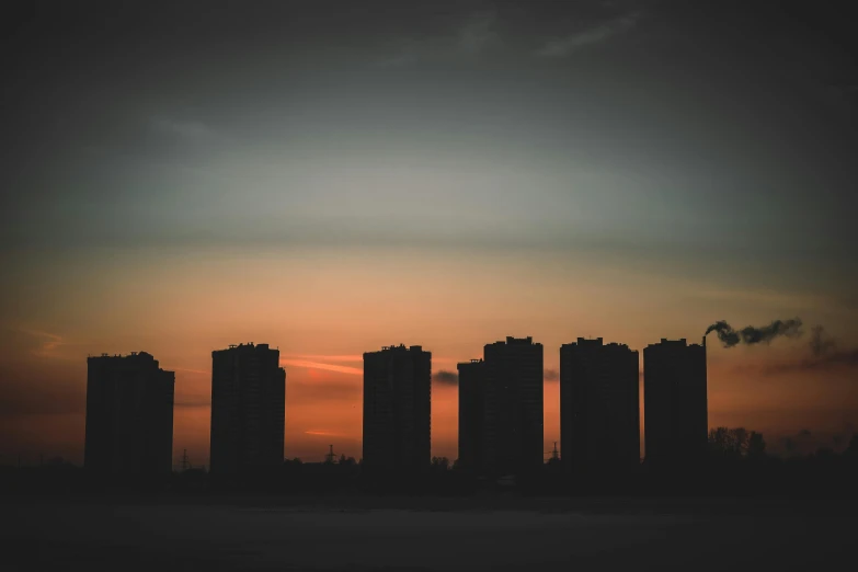 a couple of tall buildings sitting next to each other, by Attila Meszlenyi, pexels contest winner, crepuscule, in a row, plain background, high quality upload