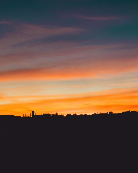 an airplane flying over a city at sunset, by Kristian Zahrtmann, pexels contest winner, fading rainbow light, agrigento, silhouette :7, panorama view of the sky