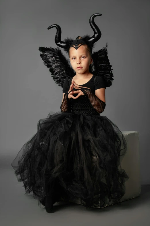 a little girl dressed up as a maleficent, an album cover, pexels contest winner, iris van herpen rankin, greta thunberg, cupid, 15081959 21121991 01012000 4k