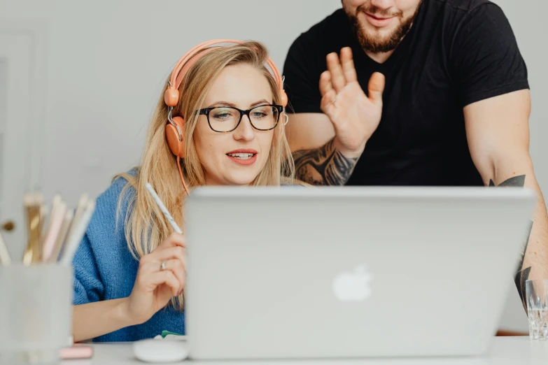 a man and a woman sitting in front of a laptop, trending on pexels, wearing a headset, avatar image, studious, high quality image