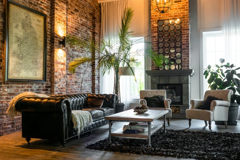 a living room with a large brick wall and a large couch