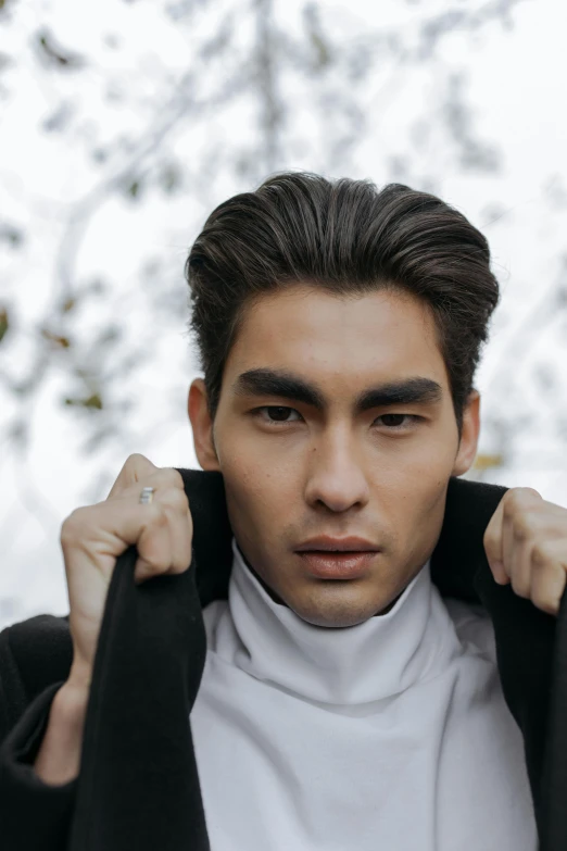 a close up of a person wearing a jacket, inspired by Tadashi Nakayama, trending on pexels, baroque, slick hair, handsome symmetrical faces, south east asian with long, christian