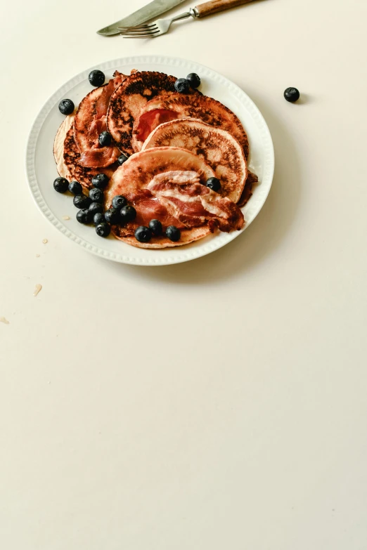 some type of blueberry dish on a white plate