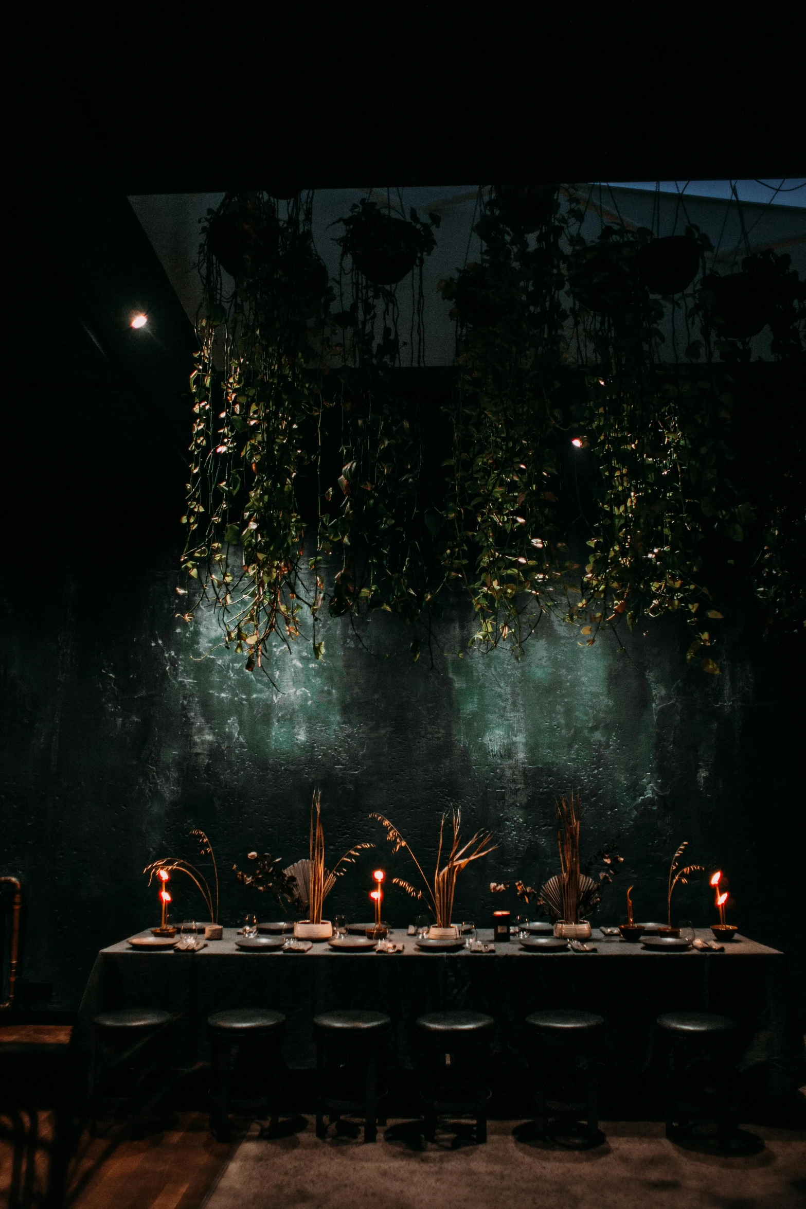 a party table with candles and cake on it