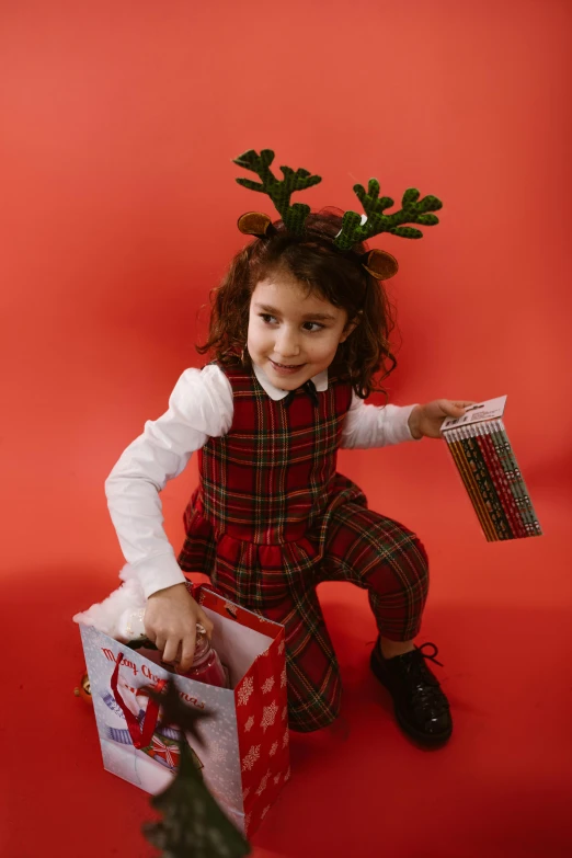 a small child with a box with presents