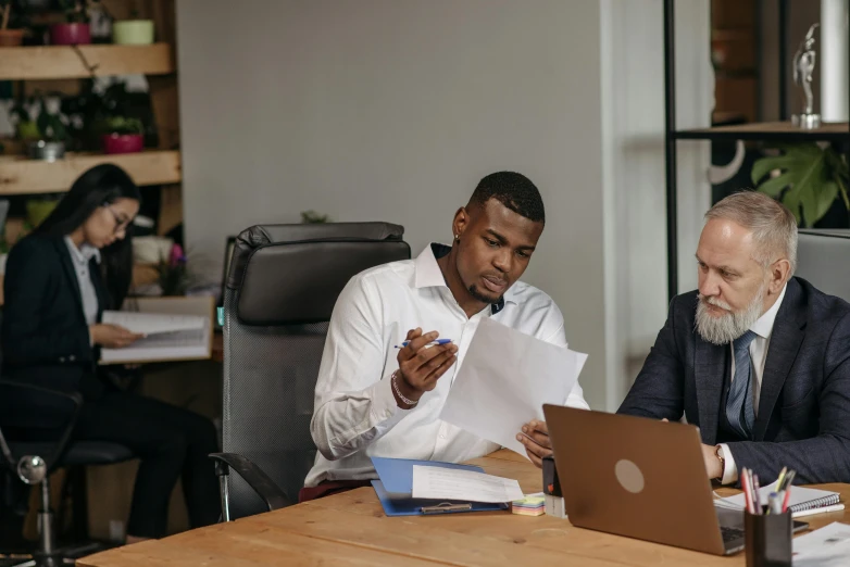 two men sitting at a table with papers in front of them, pexels contest winner, diversity, working on a laptop at a desk, 15081959 21121991 01012000 4k, thumbnail