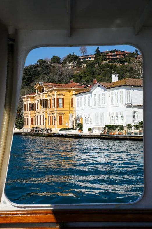 a view from a ship of buildings from the water