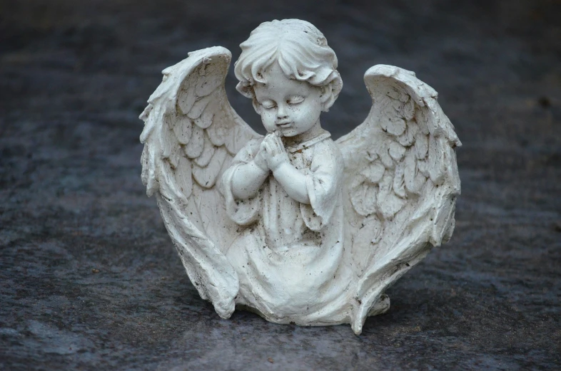 a close up of a statue of an angel, inspired by Marie Angel, pexels contest winner, praying posture, young child, wide high angle view, 3/4 front view