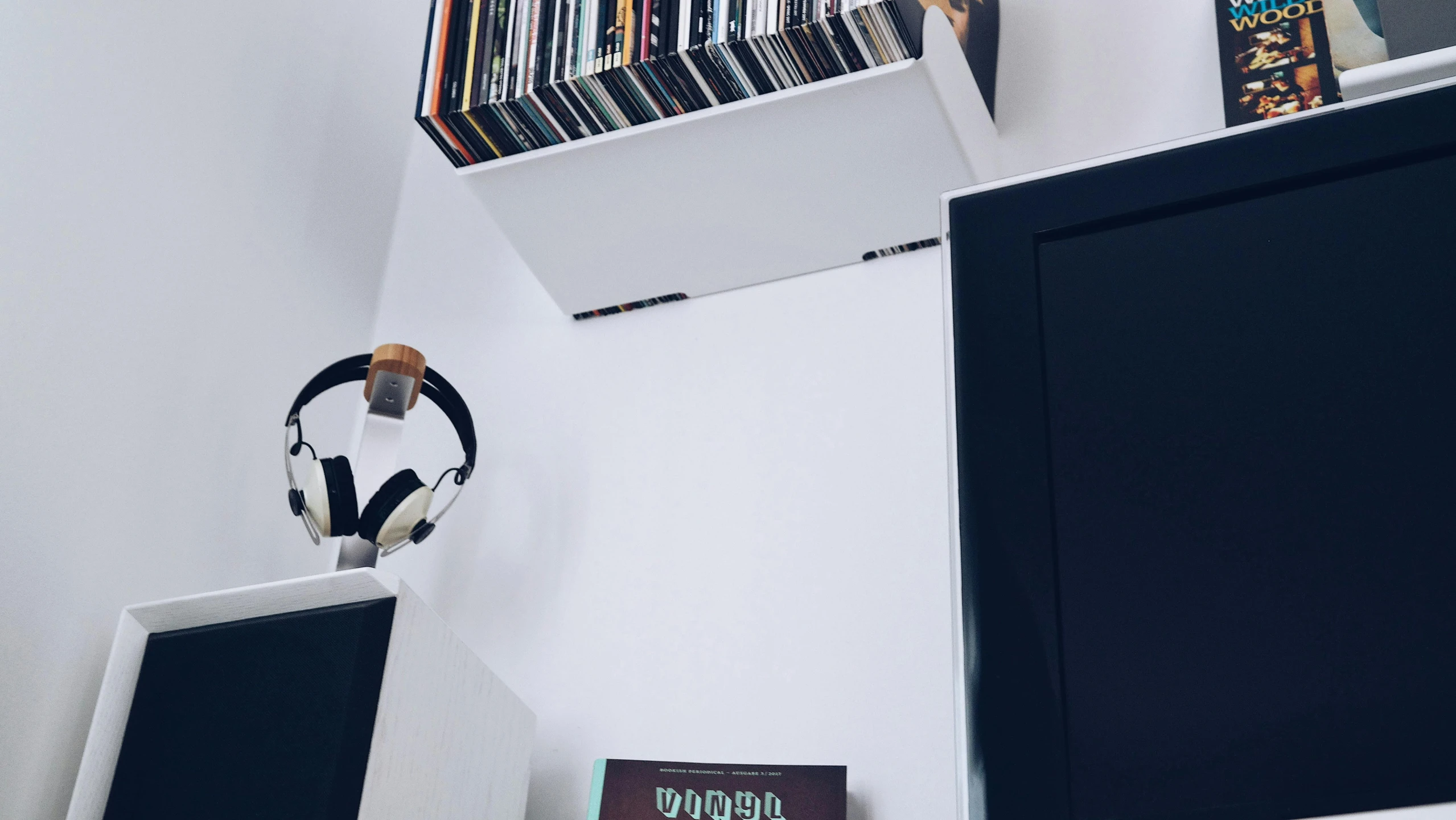 a computer monitor sitting on top of a white desk, an album cover, unsplash, shelves filled with tomes, 3/4 view from below, in my bedroom, avatar image