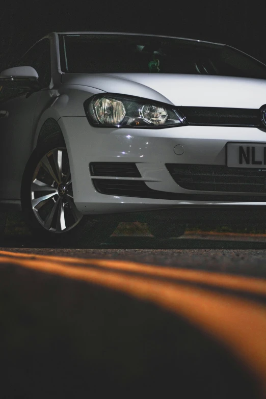 a silver car parked on the side of a road