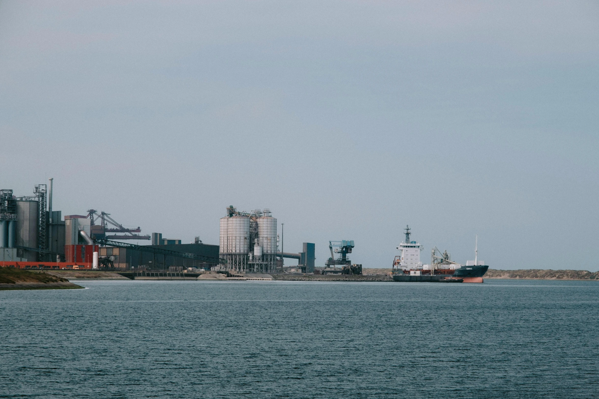 a large body of water with a boat in it, industries, hull, tyler west, sea ground