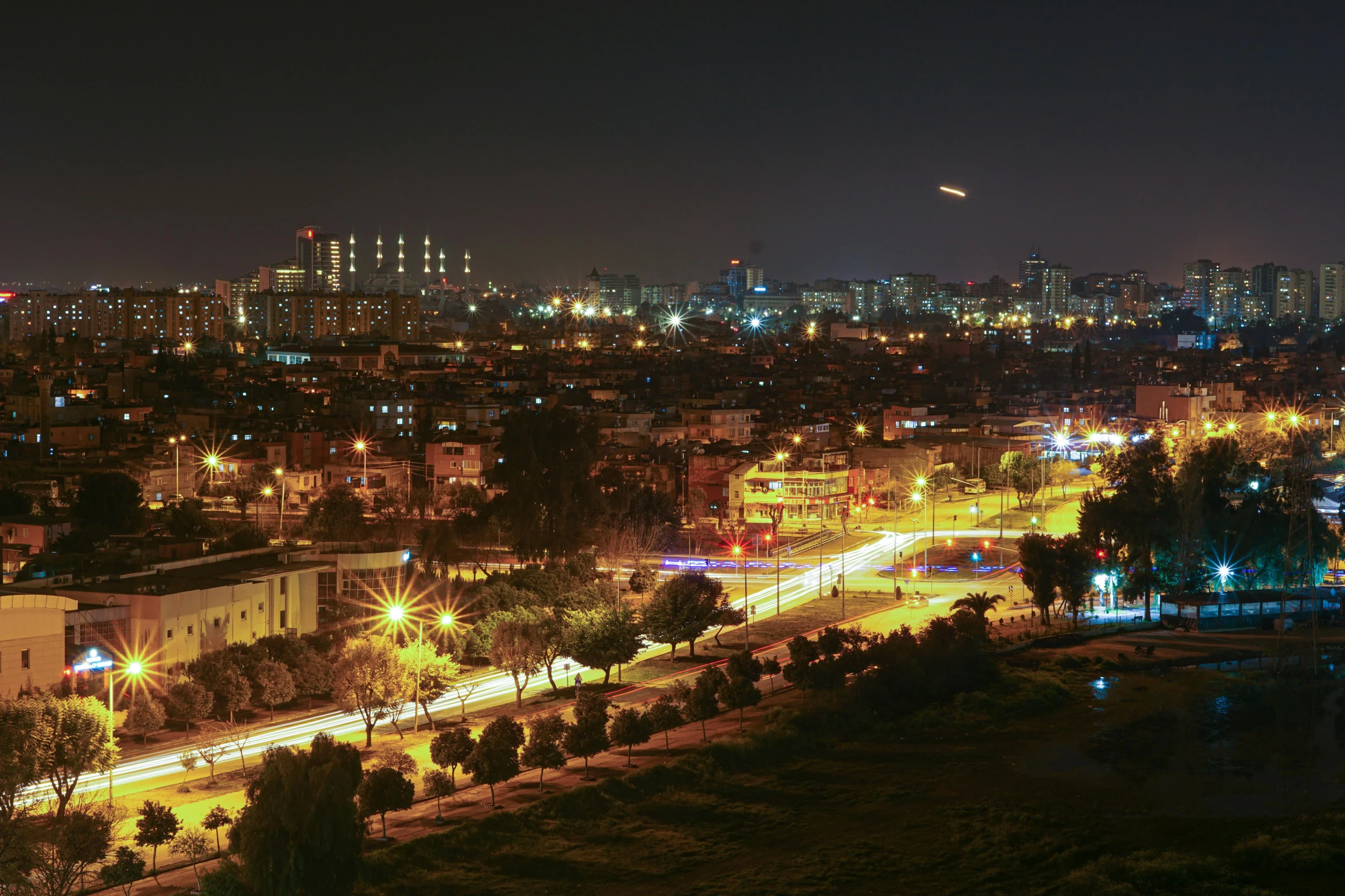 an aerial view of a city at night, by Ibrahim Kodra, pexels contest winner, hurufiyya, long view, “wide shot, turkey, indore