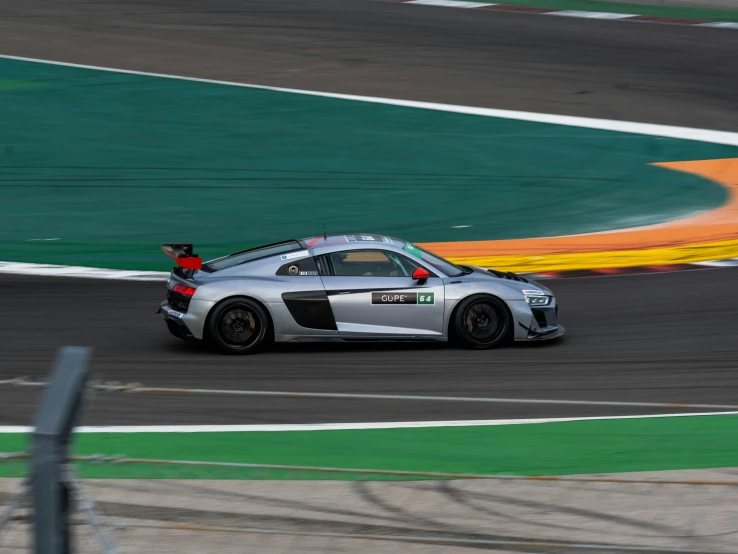 a car in racing mode with the front wheel spinning