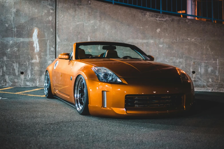 an orange sports car parked in a parking lot, a portrait, unsplash, tokyo drift, soft top, instagram post, rim lighting