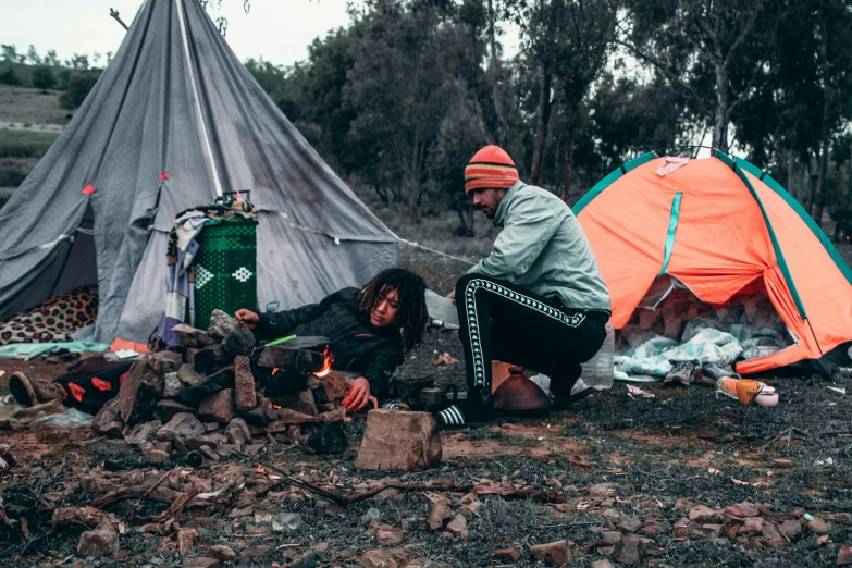 a group of people sitting around a campfire, a portrait, pexels contest winner, hurufiyya, belongings strewn about, aboriginal australian hipster, tickle fight in the death tent, avatar image