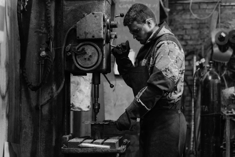 a black and white photo of a man working on a machine, pexels contest winner, rusty metal plating, vertical, brick, 15081959 21121991 01012000 4k