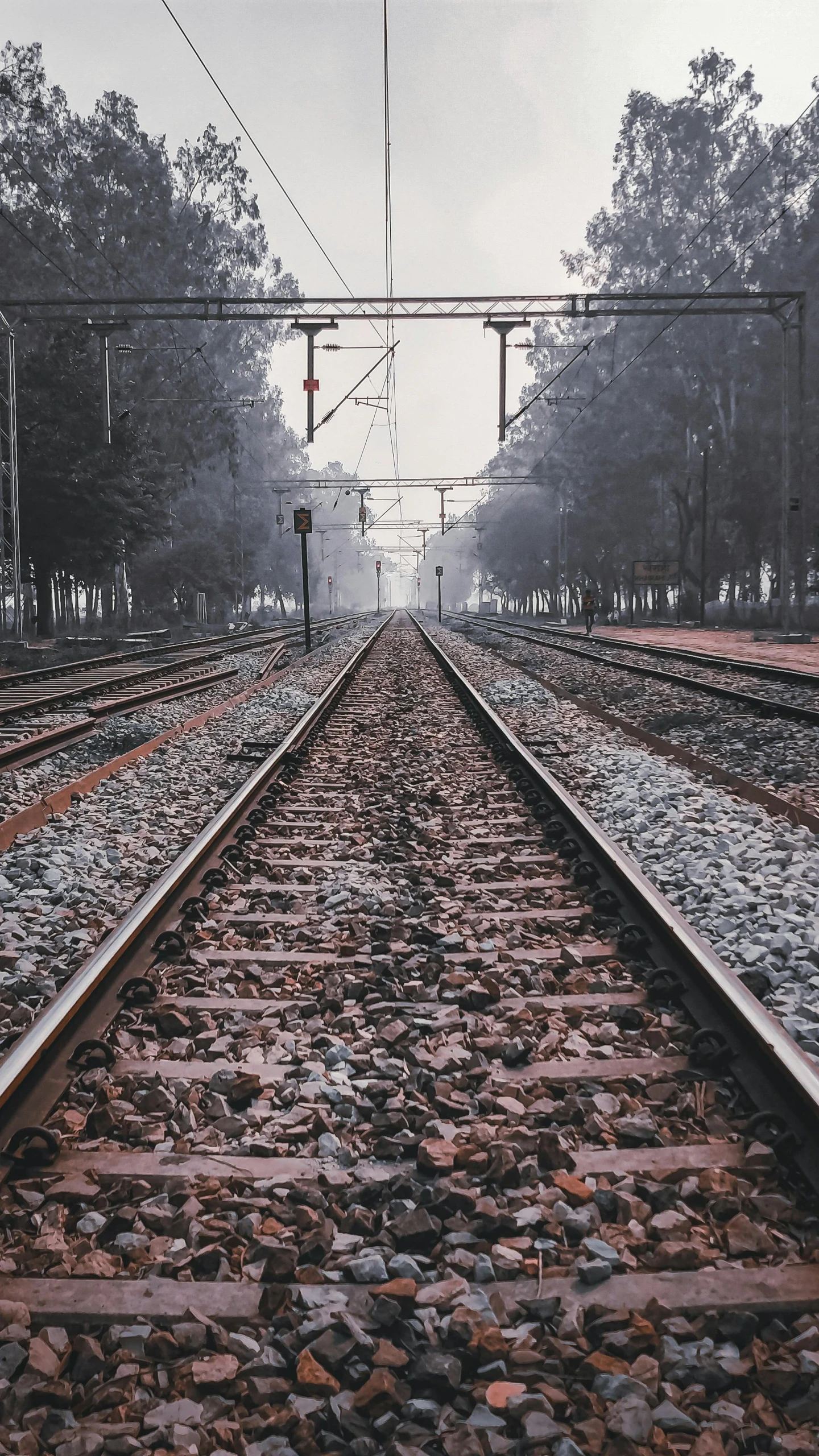 a black and white photo of a train track, an album cover, inspired by Steve McCurry, unsplash contest winner, snapchat photo, square lines, university, gloomy misty atmosphere