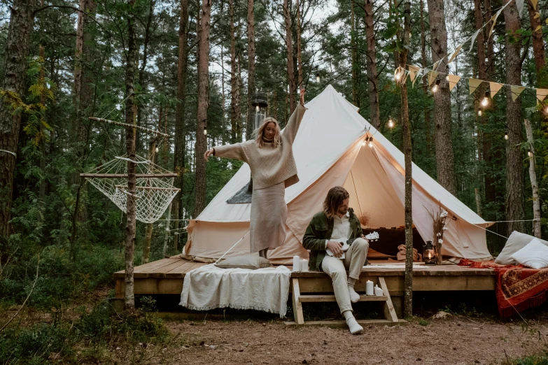 a woman standing in front of a tent in the woods, by Julia Pishtar, pexels contest winner, renaissance, couple on bed, anato finnstark and kelogsloops, holiday season, white