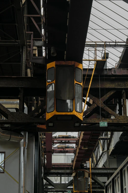 an old railway track suspended overhead by scaffolding