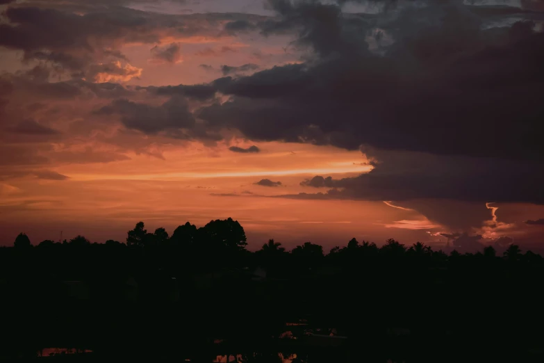 a large body of water under a cloudy sky, a picture, unsplash contest winner, australian tonalism, orange and red sky, instagram post, humid evening, multiple stories