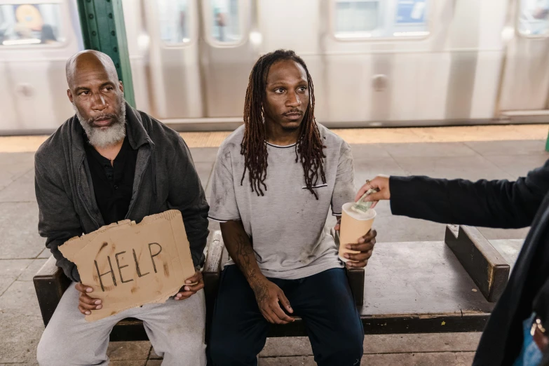 three men sitting on a bench holding signs, pexels contest winner, renaissance, donald trump as a homeless man, heron preston, ( ( theatrical ) ), subway