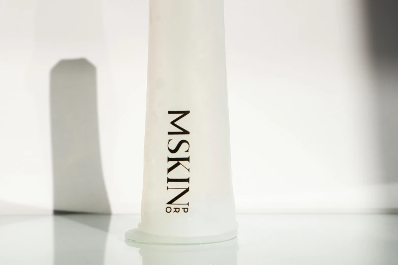 a bottle of water sitting on top of a table, a marble sculpture, ((mist)), product lighting, synthetic bio skin, bekinski