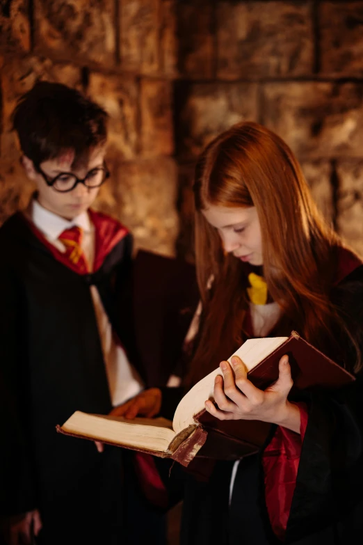 a couple of people standing next to each other, inspired by Hermione Hammond, pexels contest winner, academic art, wizard reading a directory, inside a crypt, wearing headmistress uniform, boys