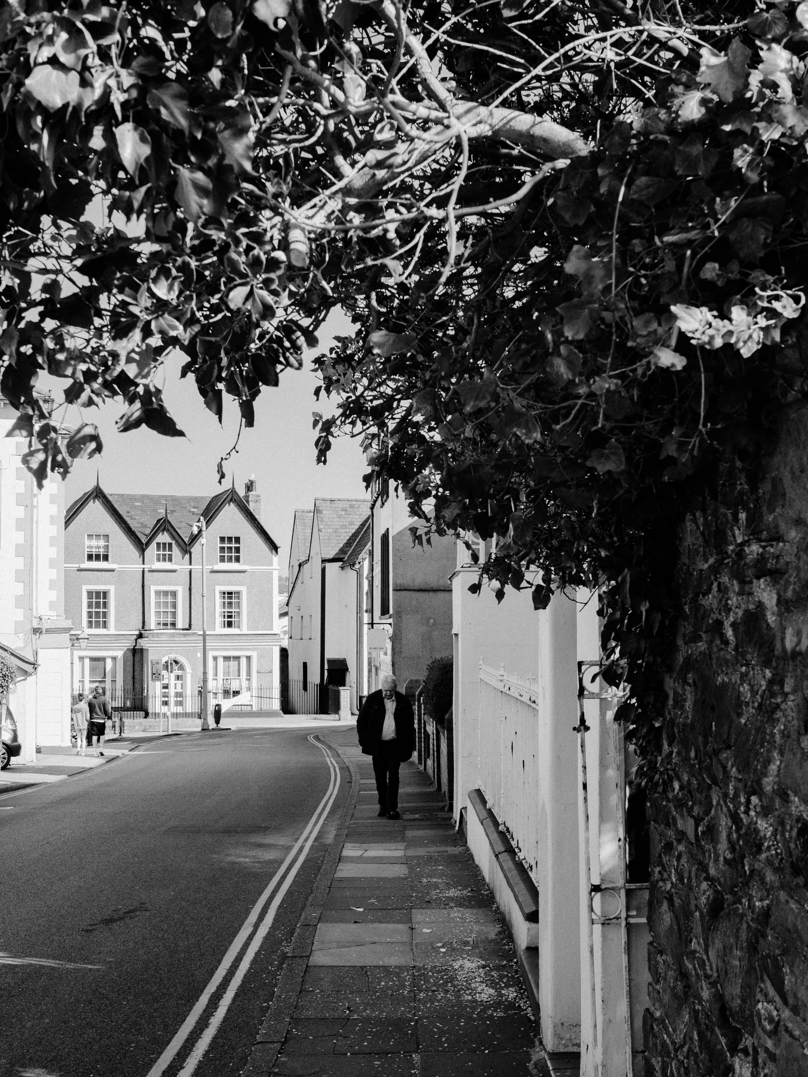 a man walking down the street of an alley way