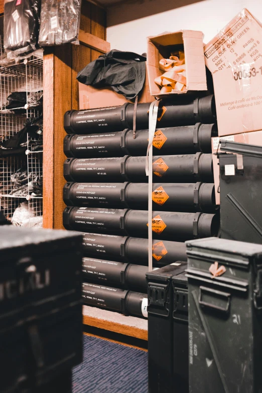 a room filled with lots of boxes and boxes, by Daniel Lieske, unsplash, hurufiyya, black swat vest, black and terracotta, weapon shop interior, ✨🕌🌙