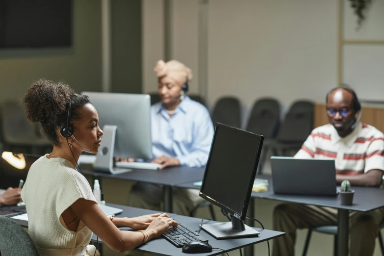 a group of people sitting in front of computers, photo of a black woman, wearing a headset, pacing, ad image