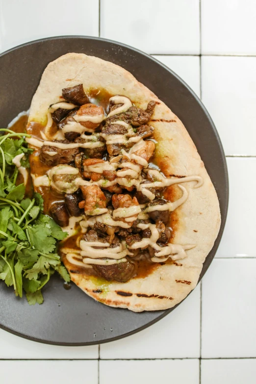 a close up of a plate of food on a table, hurufiyya, front facing shot, light tan, taco, mongol