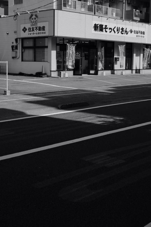 black and white image of the side of an asian building