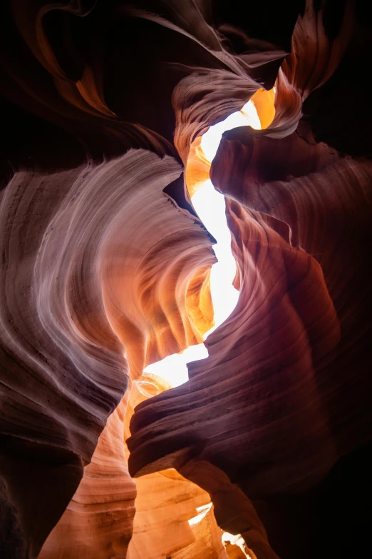 an image of the inside of a canyon, an abstract sculpture, by Daniel Taylor, pexels contest winner, light and space, flames around body, god light shafts, smooth shapes and lines, incredible colors