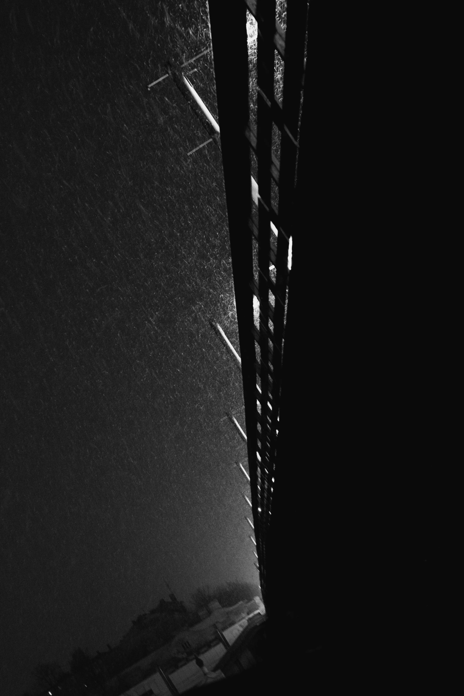 a black and white photo of a bridge at night, a black and white photo, inspired by Ryoji Ikeda, postminimalism, icicle, looking up onto the sky, harsh sunlight, square lines