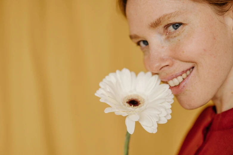 a close up of a person holding a flower, by Carey Morris, aestheticism, smiling mouth, with a white complexion, avatar image, warm friendly expression