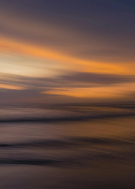 a large body of water with a sunset in the background, by Andrew Geddes, tonalism, fractal waves, long exposure photograph, orange clouds, grey