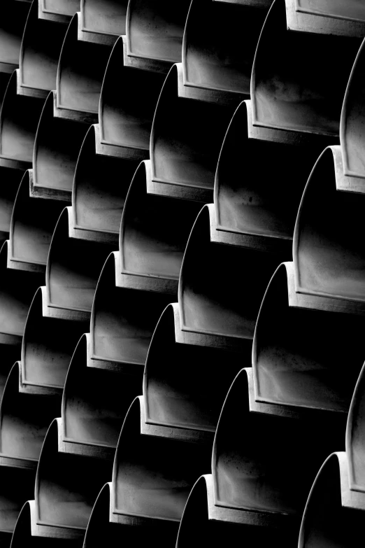 a black and white photo of a building, inspired by Edward Weston, bargello pattern, barrels, [ metal ], 84mm)