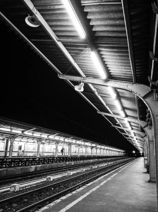 a black and white photo of a train station, by Kristian Kreković, night. by greg rutkowski, square lines, beautiful photo, scifi platform