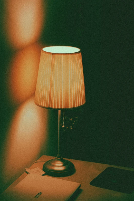 a lamp sitting on top of a wooden table