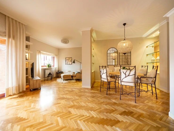 an empty living room and dining area in an apartment