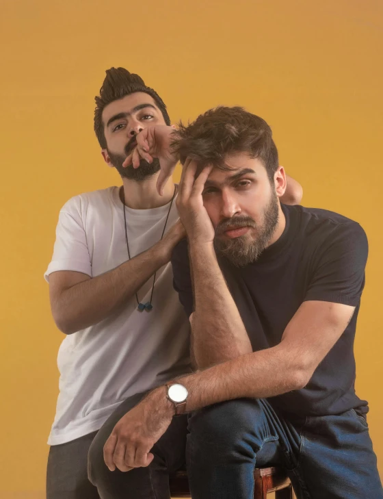 a couple of men sitting next to each other, an album cover, by Adam Dario Keel, pexels contest winner, antipodeans, doing a sassy pose, headshot profile picture, background : diego fazio, beardless