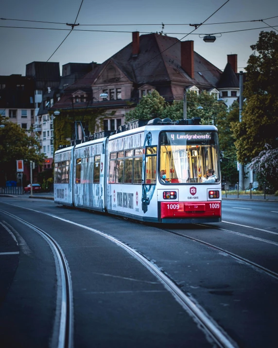 a white and red tram traveling down a street, by Kristian Zahrtmann, pexels contest winner, detmold, transgender, thumbnail, multiple stories
