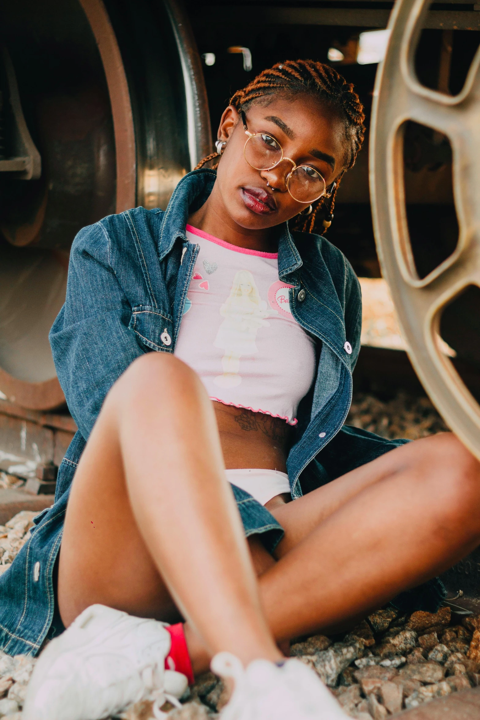 an image of a girl sitting in the dirt