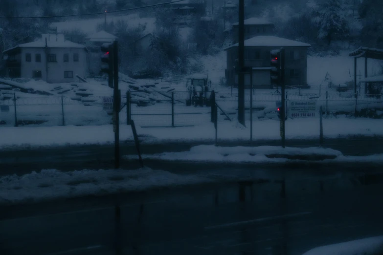 traffic lights in the snow in a neighborhood