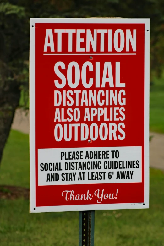 this is a sign in a rural area telling visitors to socialize
