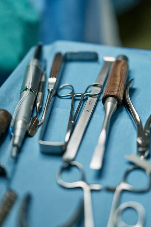 a bunch of tools sitting on top of a blue table, surgery theatre, photograph credit: ap, multiple stories, dentist