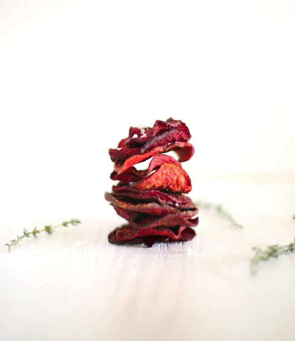 a stack of dried strawberries sitting on top of a table, by Emma Andijewska, pexels, renaissance, crisps, vine twist, red velvet, profile image